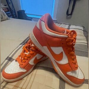 Orange and white Nike Dunks